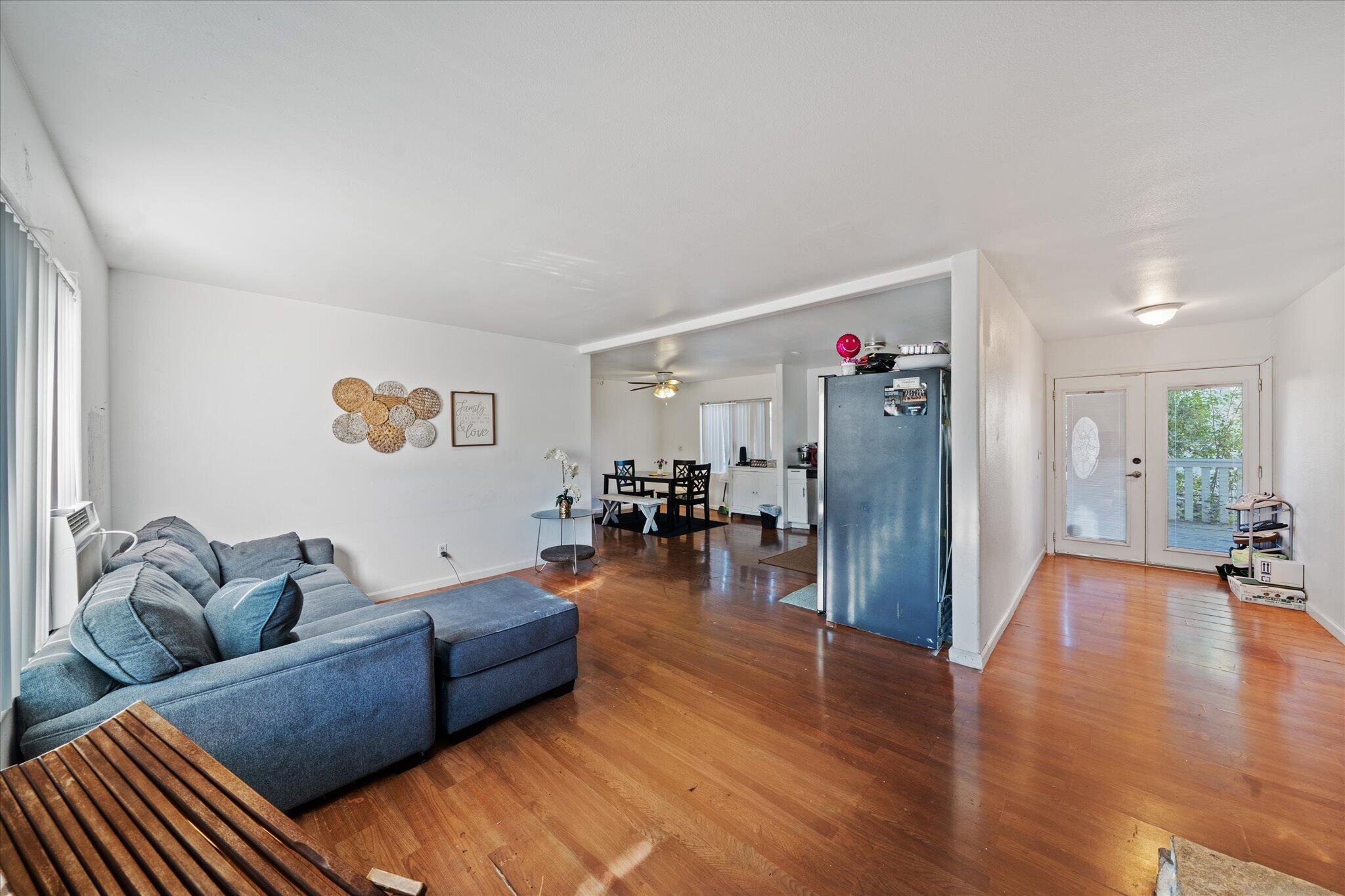 2494 Delta Place, Unit 71 Redding, CA 96002 - Photo 7 of 24 a living room with furniture and a wooden floor