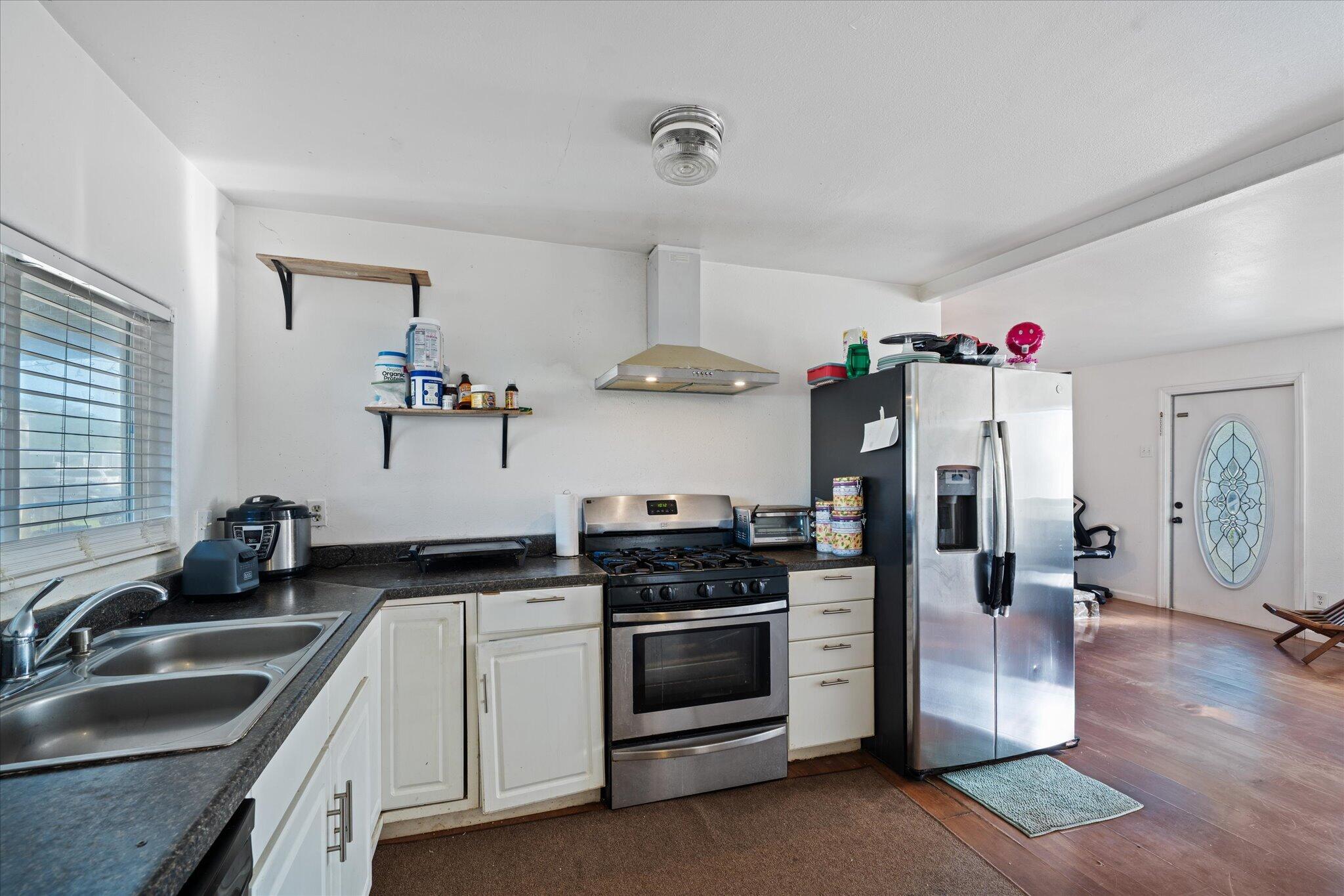 2494 Delta Place, Unit 71 Redding, CA 96002 - Photo 10 of 24 a kitchen with a sink stove and refrigerator