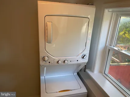 a close view of utility room with a washer and dryer