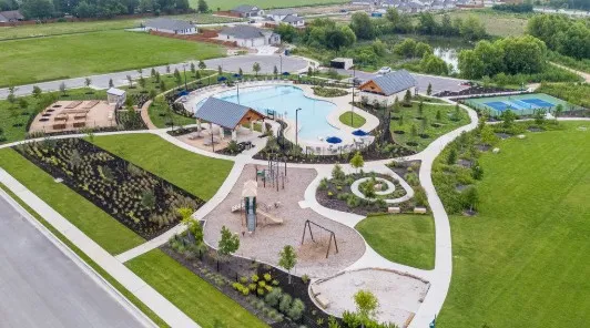 a view of a swimming pool and outdoor seating
