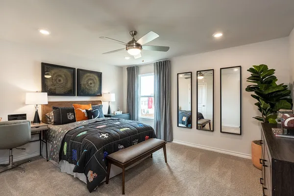 a spacious bathroom with a double vanity sink a mirror and a bathtub