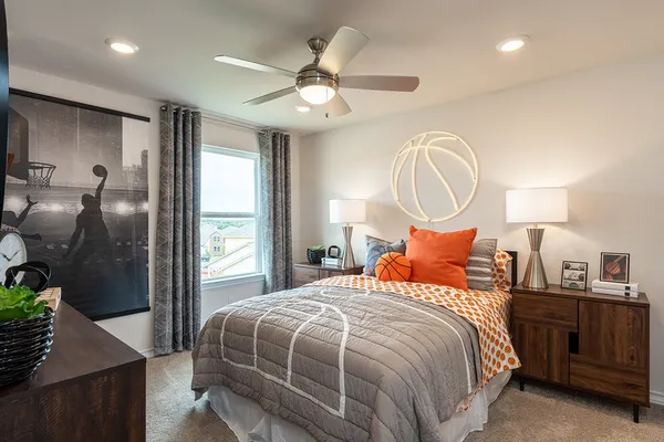 a bed room with a bed and a chandelier