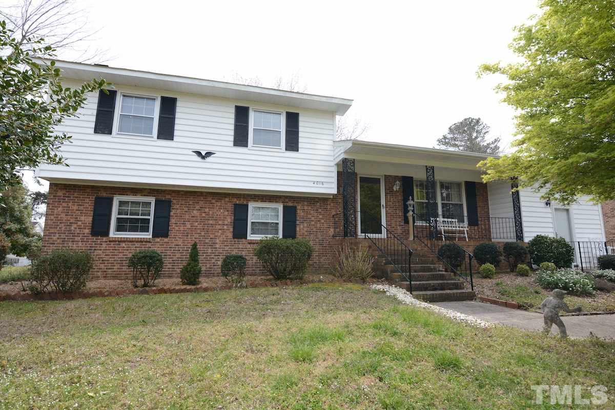 4016 Willow Oak Road Raleigh, NC 27604 - Photo 1 of 21 a front view of a house with garden