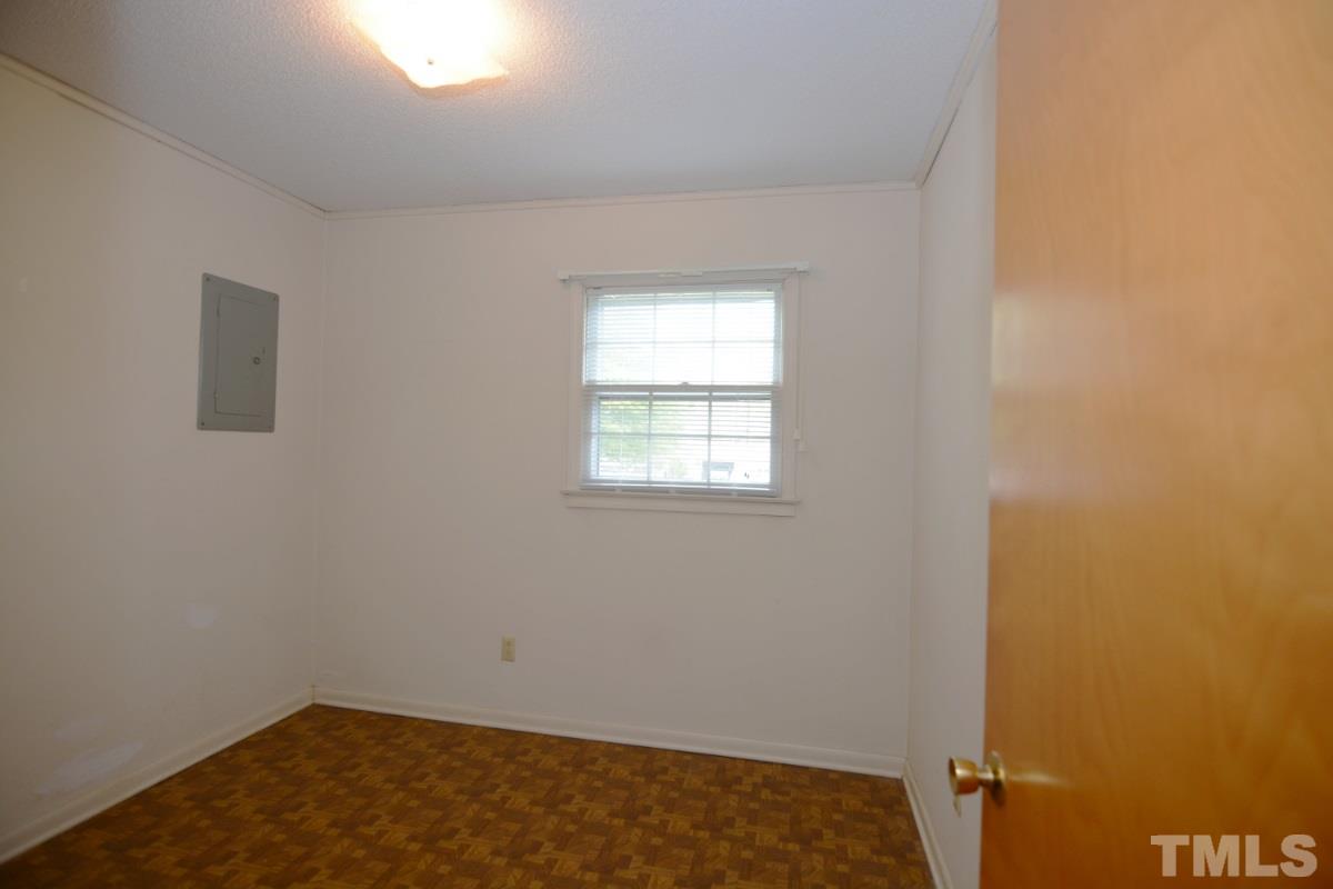 4016 Willow Oak Road Raleigh, NC 27604 - Photo 17 of 21 an empty room with a window