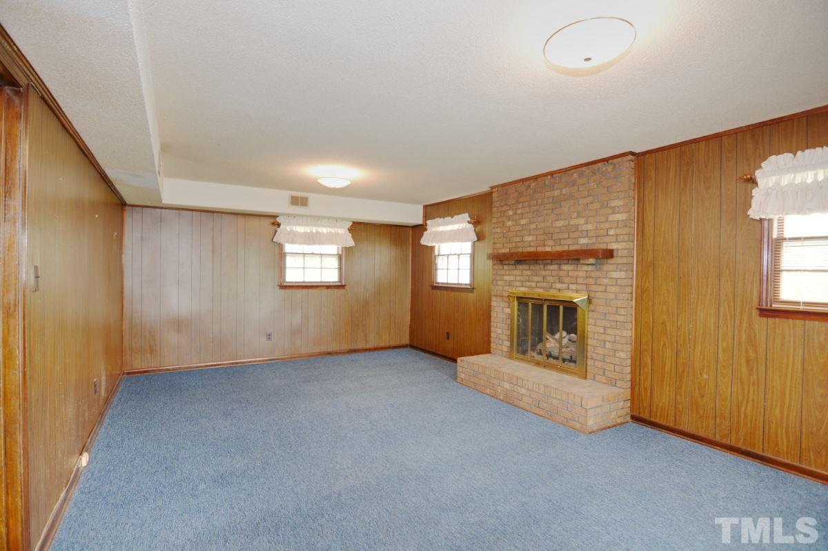 4016 Willow Oak Road Raleigh, NC 27604 - Photo 19 of 21 an empty room with windows and fireplace