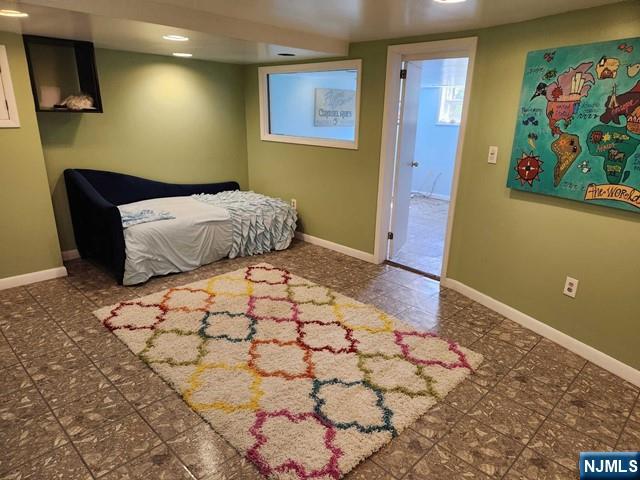 276 Franklin Turnpike Ridgewood, NJ 07450 - Photo 15 of 23 a bedroom with a bed and a painting on the wall