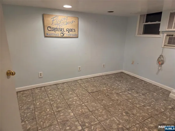 a view of an empty room and wooden floor