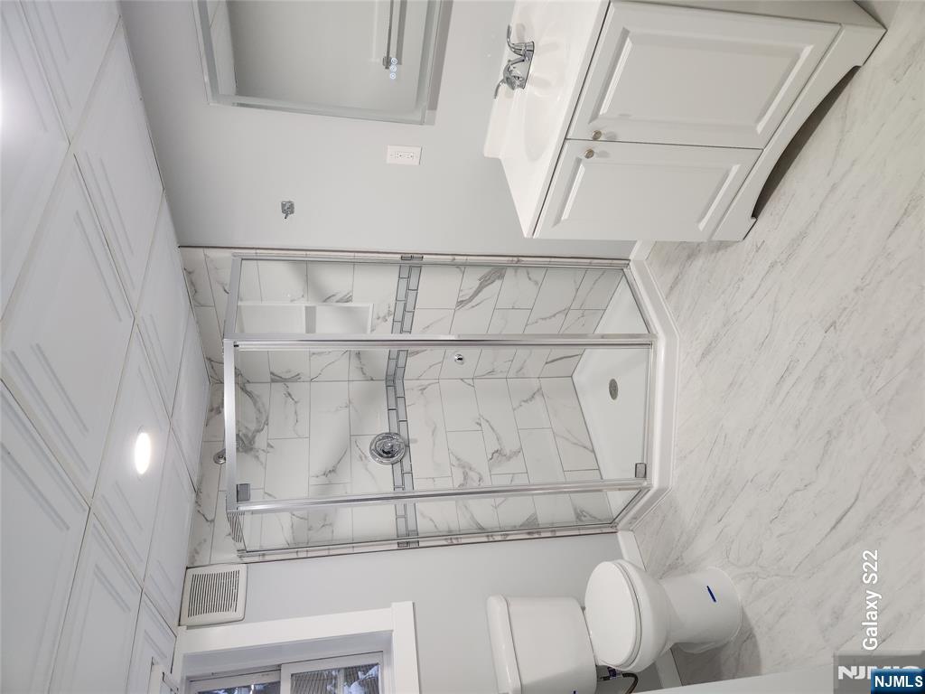 276 Franklin Turnpike Ridgewood, NJ 07450 - Photo 3 of 23 a bathroom with a sink toilet and shower