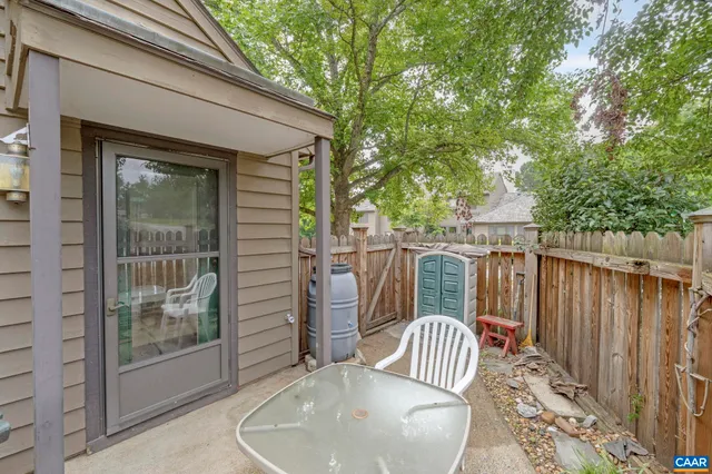 a view of a chair and table in the balcony
