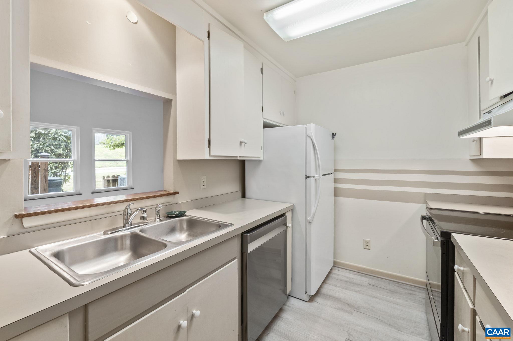 767 Exton Court Charlottesville, VA 22901 - Photo 23 of 34 a kitchen with stainless steel appliances granite countertop a sink stove and refrigerator