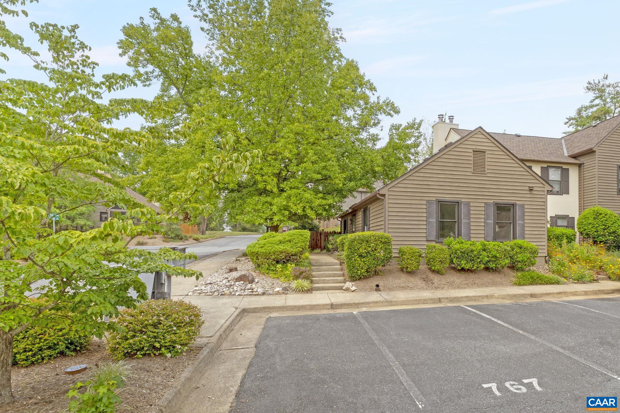 767 Exton Court Charlottesville, VA 22901 - Photo 10 of 34 a front view of a house with a yard and a garage