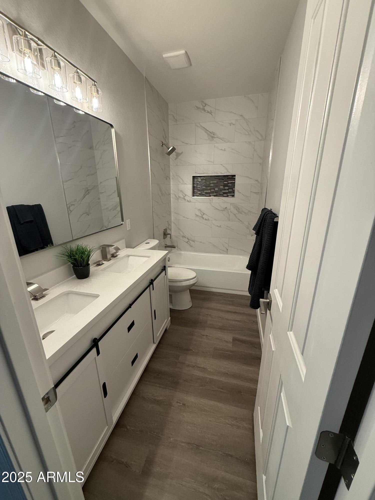 2972 West South Butte Road Queen Creek, AZ 85144 - Photo 14 of 17 a bathroom with a sink a toilet and mirror