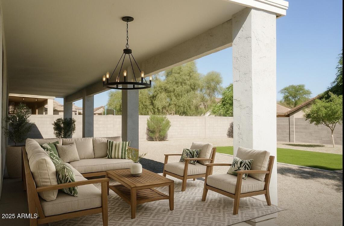 2972 West South Butte Road Queen Creek, AZ 85144 - Photo 17 of 17 a living room with patio furniture and a floor to ceiling window