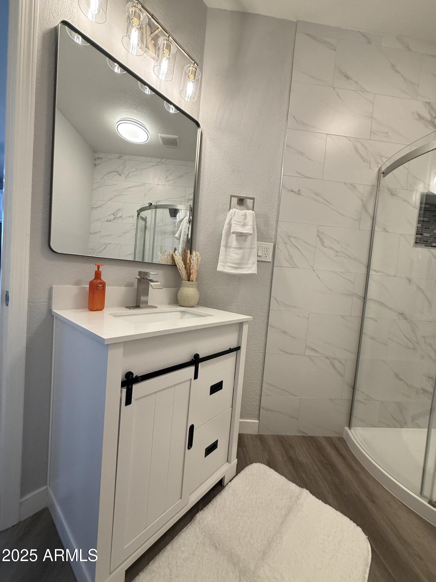 2972 West South Butte Road Queen Creek, AZ 85144 - Photo 7 of 17 a bathroom with a sink a toilet and mirror