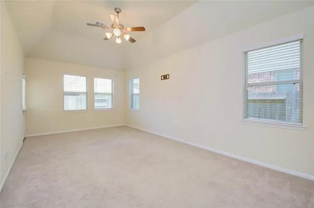 a view of an empty room with a window