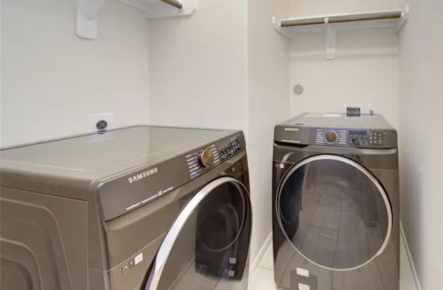 a utility room with dryer and washer