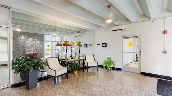 a view of a hallway and dining room