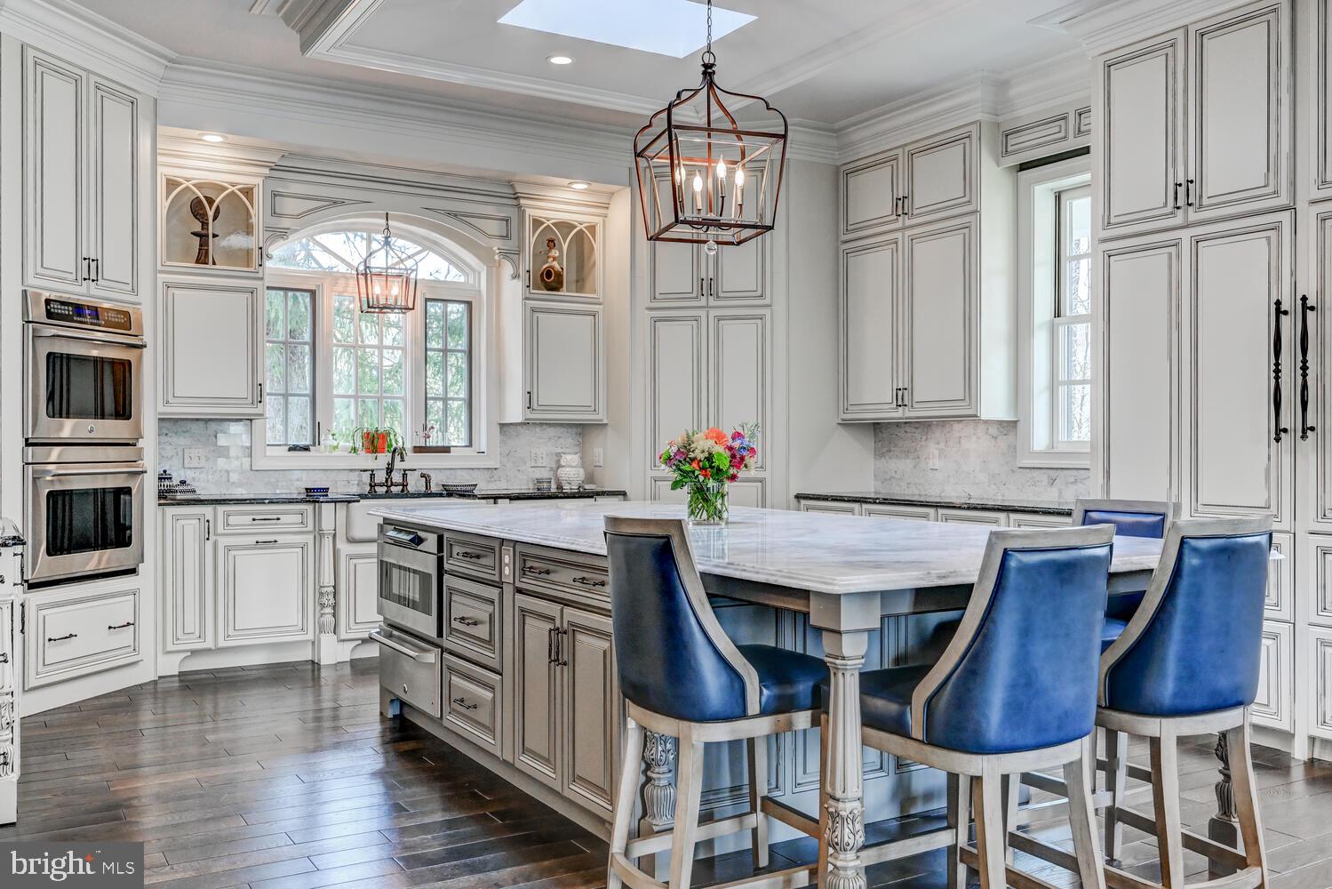 1848 Circle Road Towson, MD 21204 - Photo 12 of 69 a kitchen with stainless steel appliances a dining table and chairs