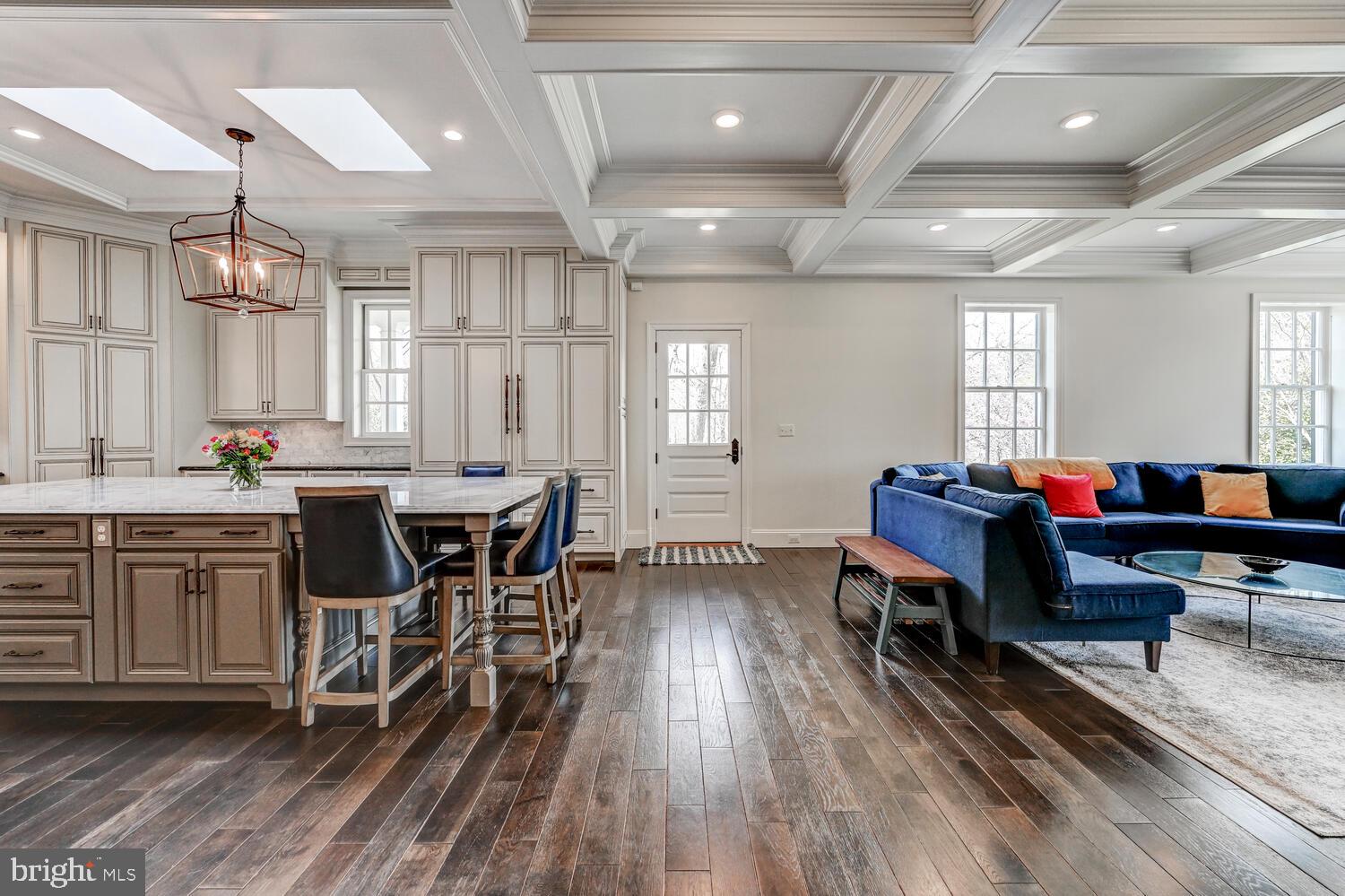1848 Circle Road Towson, MD 21204 - Photo 14 of 69 a living room with furniture a dining table wooden floor and a fireplace