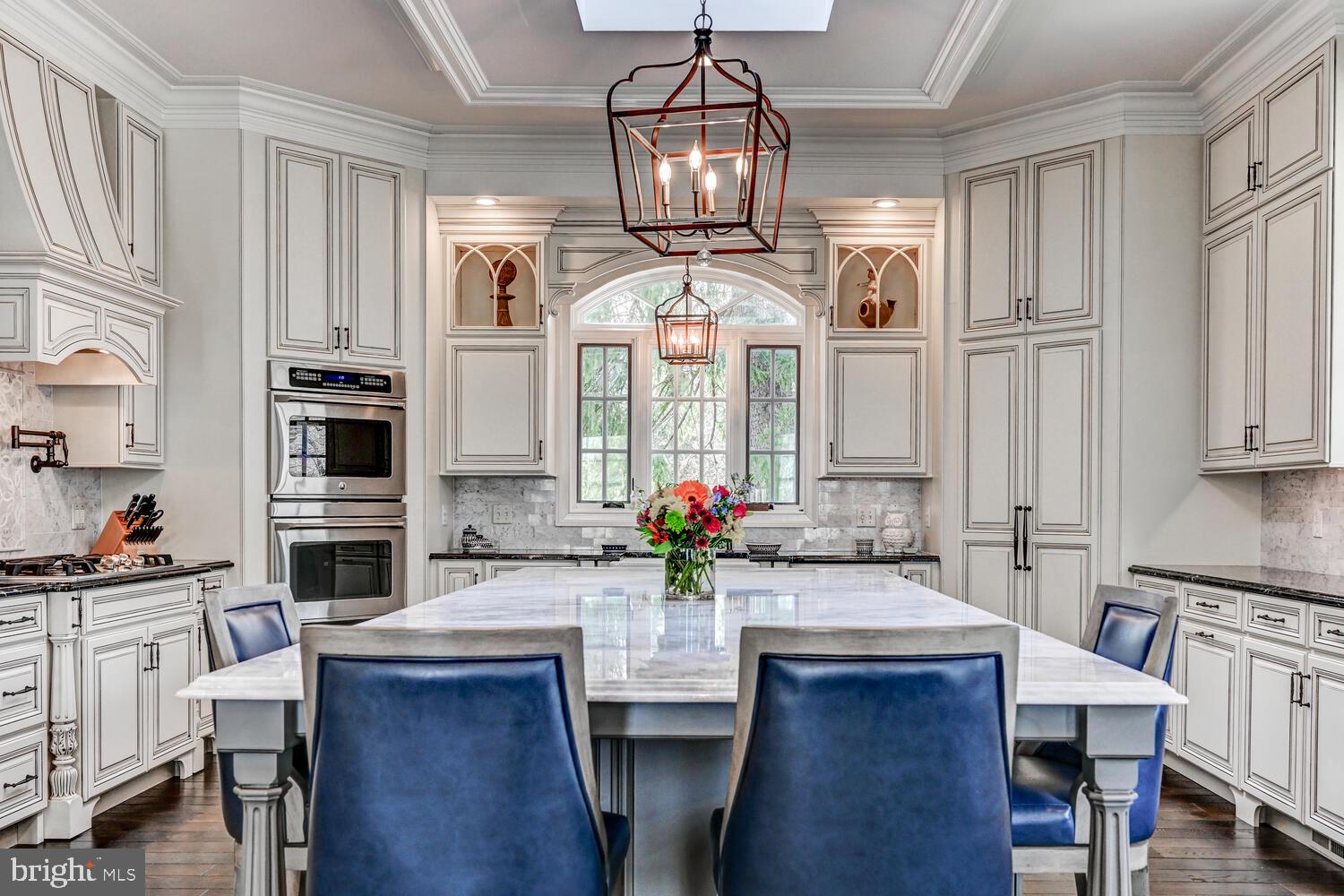 1848 Circle Road Towson, MD 21204 - Photo 18 of 69 a view of a dining room with furniture a chandelier and wooden floor