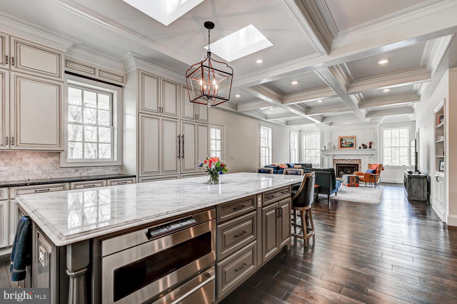 1848 Circle Road Towson, MD 21204 - Photo 22 of 69 a kitchen with stainless steel appliances granite countertop a lot of counter space and wooden floors