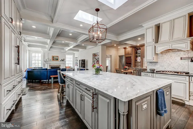 a large bedroom with wooden floor and furniture