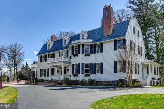 a dining room with furniture window and wooden floor