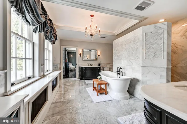 a view of patio with chairs and tables on the patio