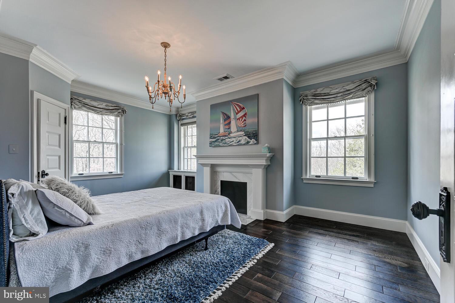 1848 Circle Road Towson, MD 21204 - Photo 42 of 69 a spacious bedroom with a bed and a fireplace