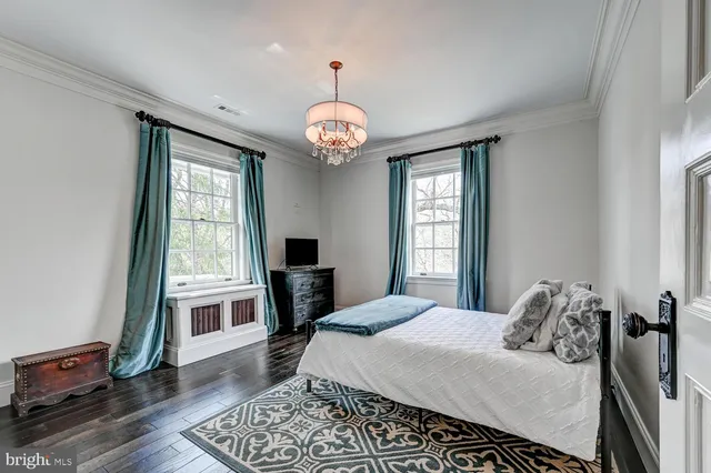 an outdoor sitting area with furniture and garden