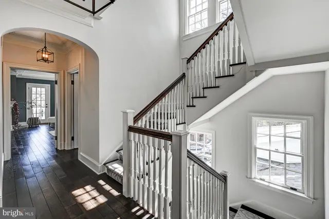 a front view of a house with swimming pool and a yard