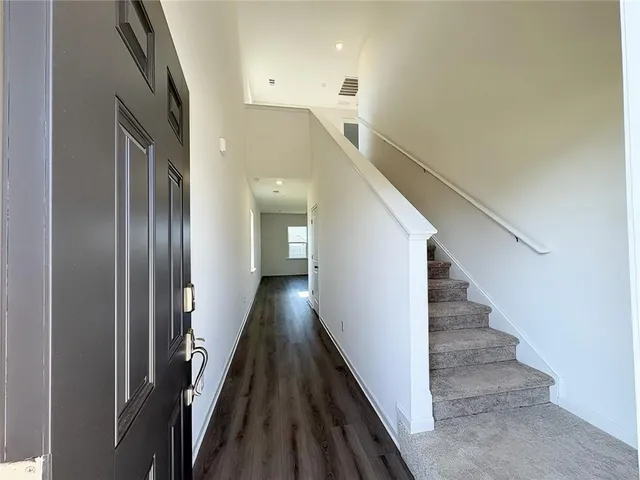 a view of a hallway with staircase