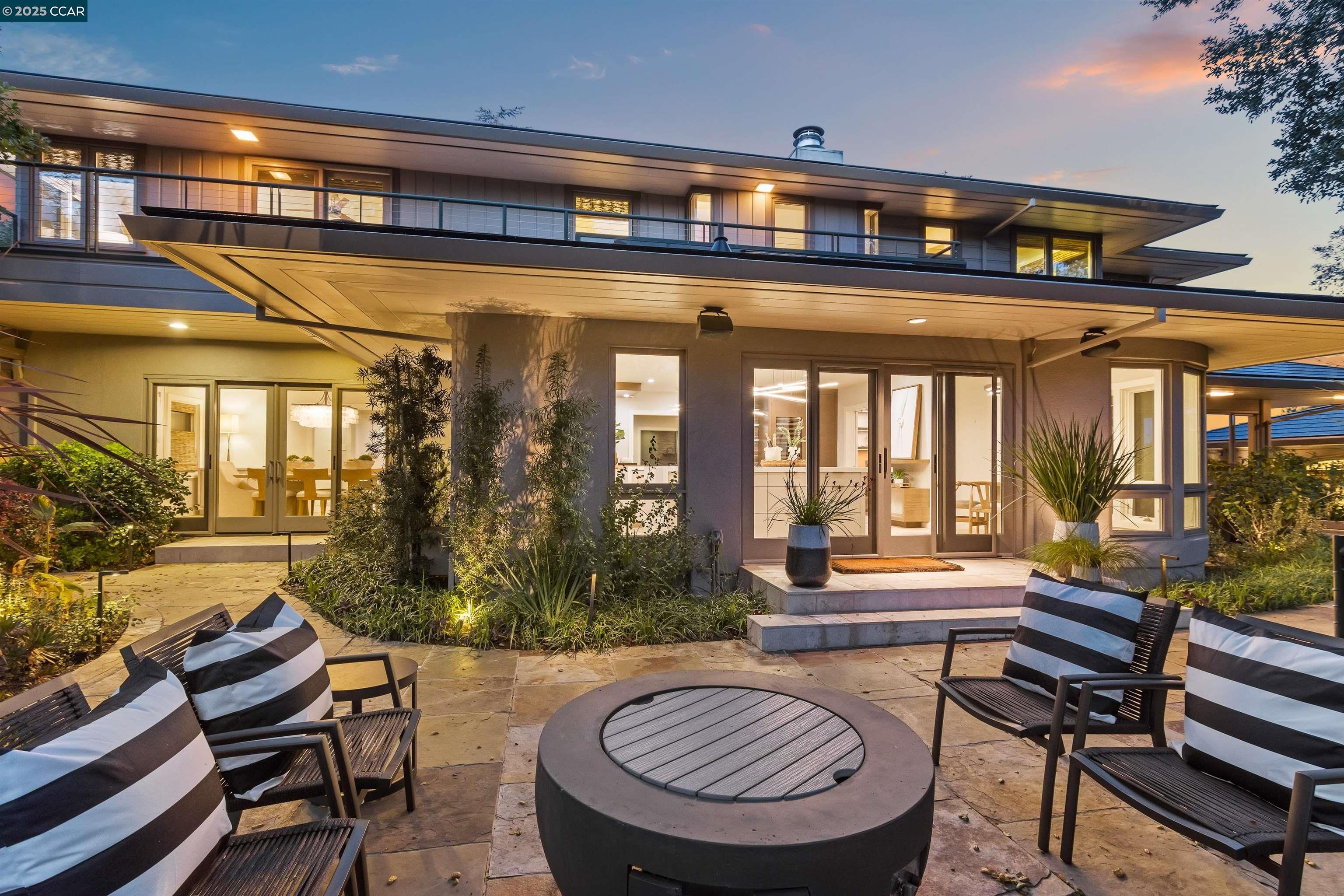 a outdoor living space with furniture and a fireplace