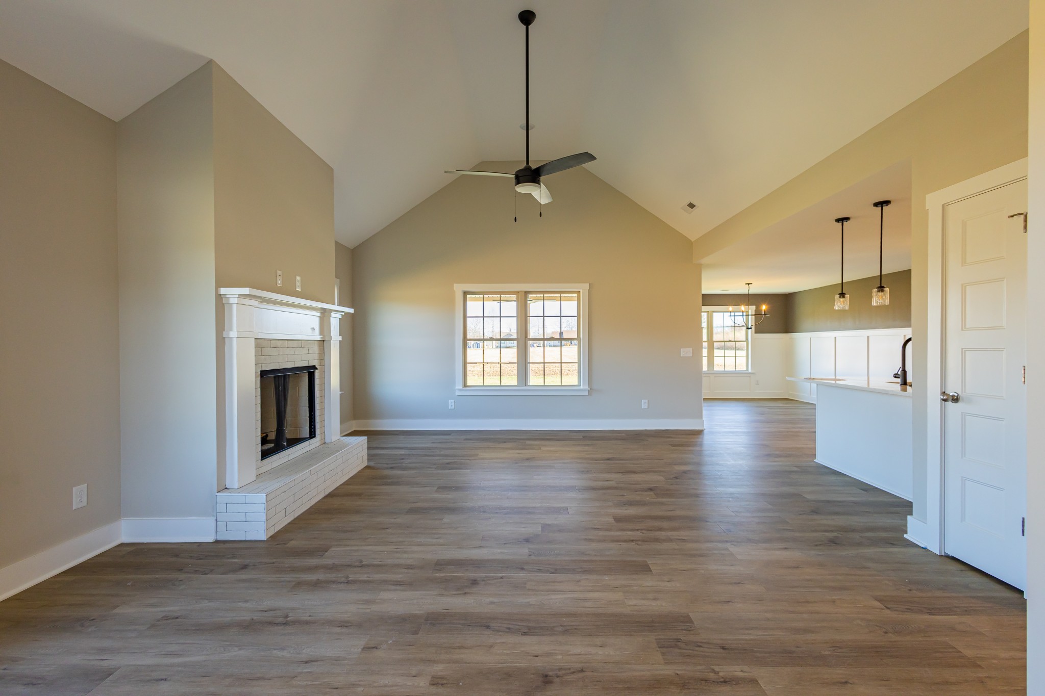 31 Brooklyn Avenue Manchester, TN 37355 - Photo 16 of 66 a view of an empty room with wooden floor fireplace and a window