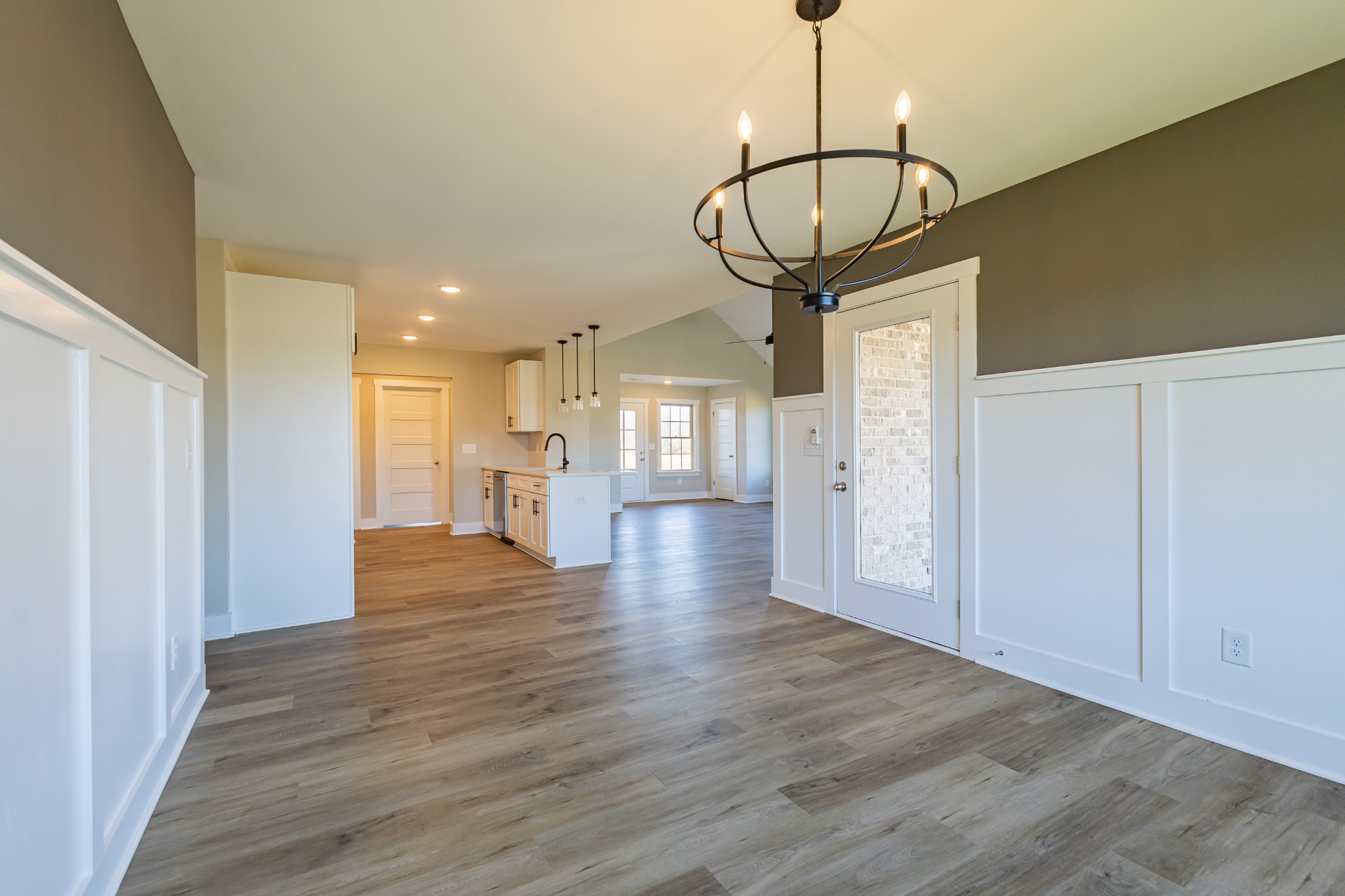 31 Brooklyn Avenue Manchester, TN 37355 - Photo 20 of 66 a view of a hallway with wooden floor windows and a chandelier