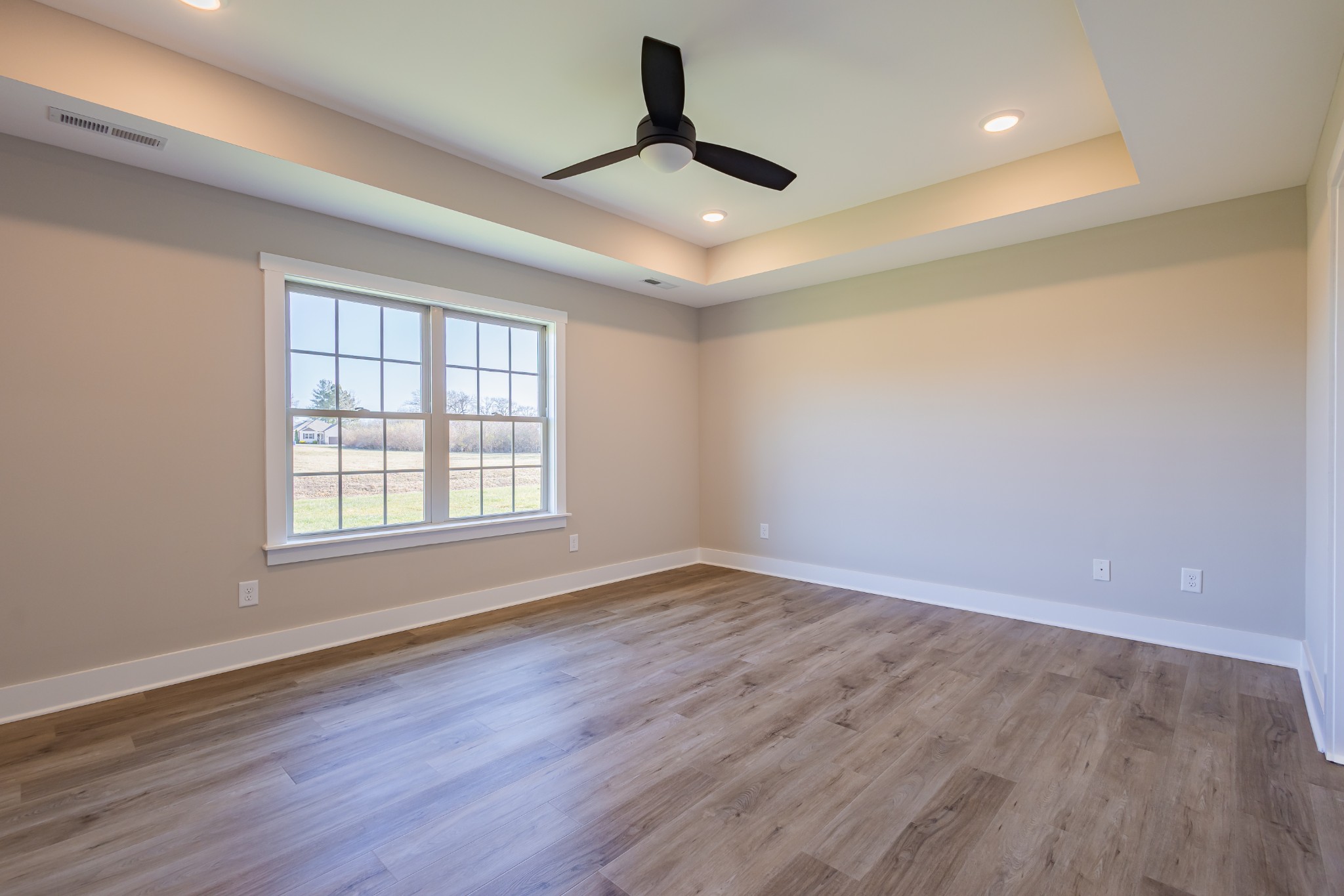 31 Brooklyn Avenue Manchester, TN 37355 - Photo 21 of 66 a view of an empty room with wooden floor and a window