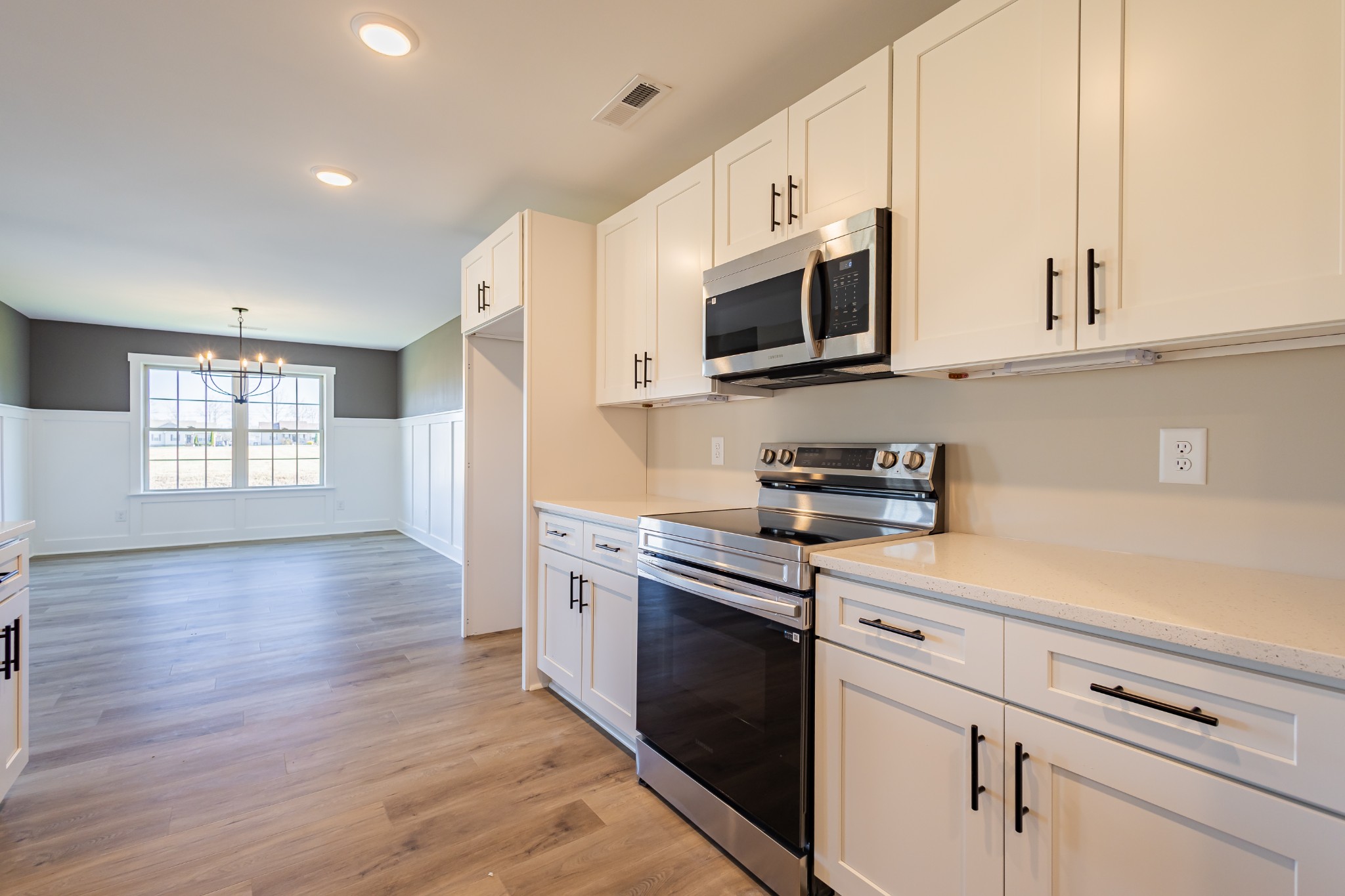 31 Brooklyn Avenue Manchester, TN 37355 - Photo 27 of 66 a kitchen with stainless steel appliances granite countertop a sink a stove a microwave and cabinets