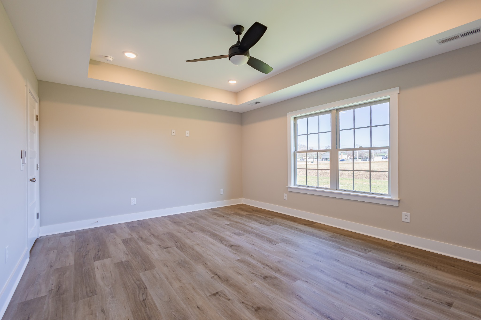 31 Brooklyn Avenue Manchester, TN 37355 - Photo 37 of 66 wooden floor in an empty room with a window