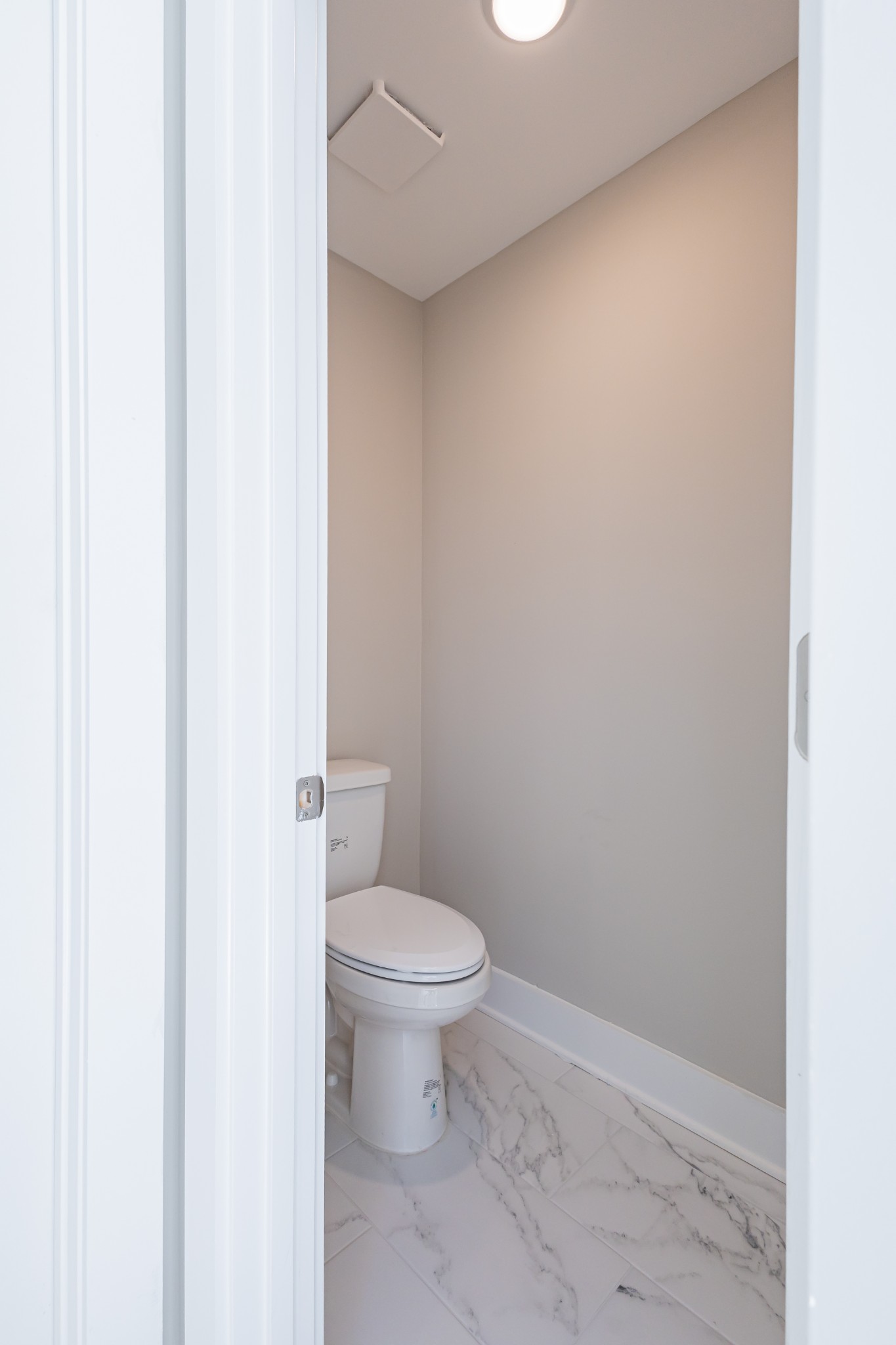 31 Brooklyn Avenue Manchester, TN 37355 - Photo 44 of 66 a white toilet sitting next to a white cabinet