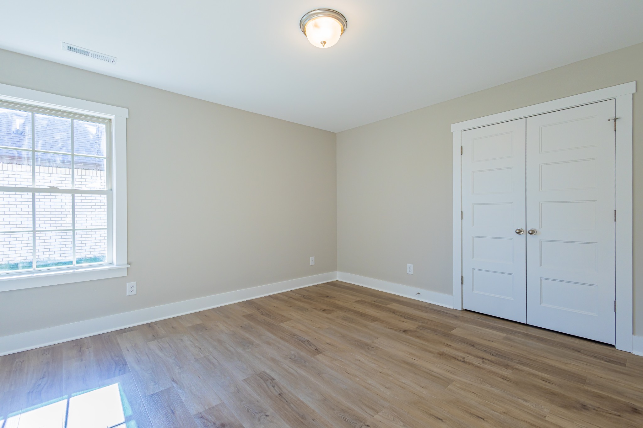 31 Brooklyn Avenue Manchester, TN 37355 - Photo 45 of 66 an empty room with wooden floor and windows