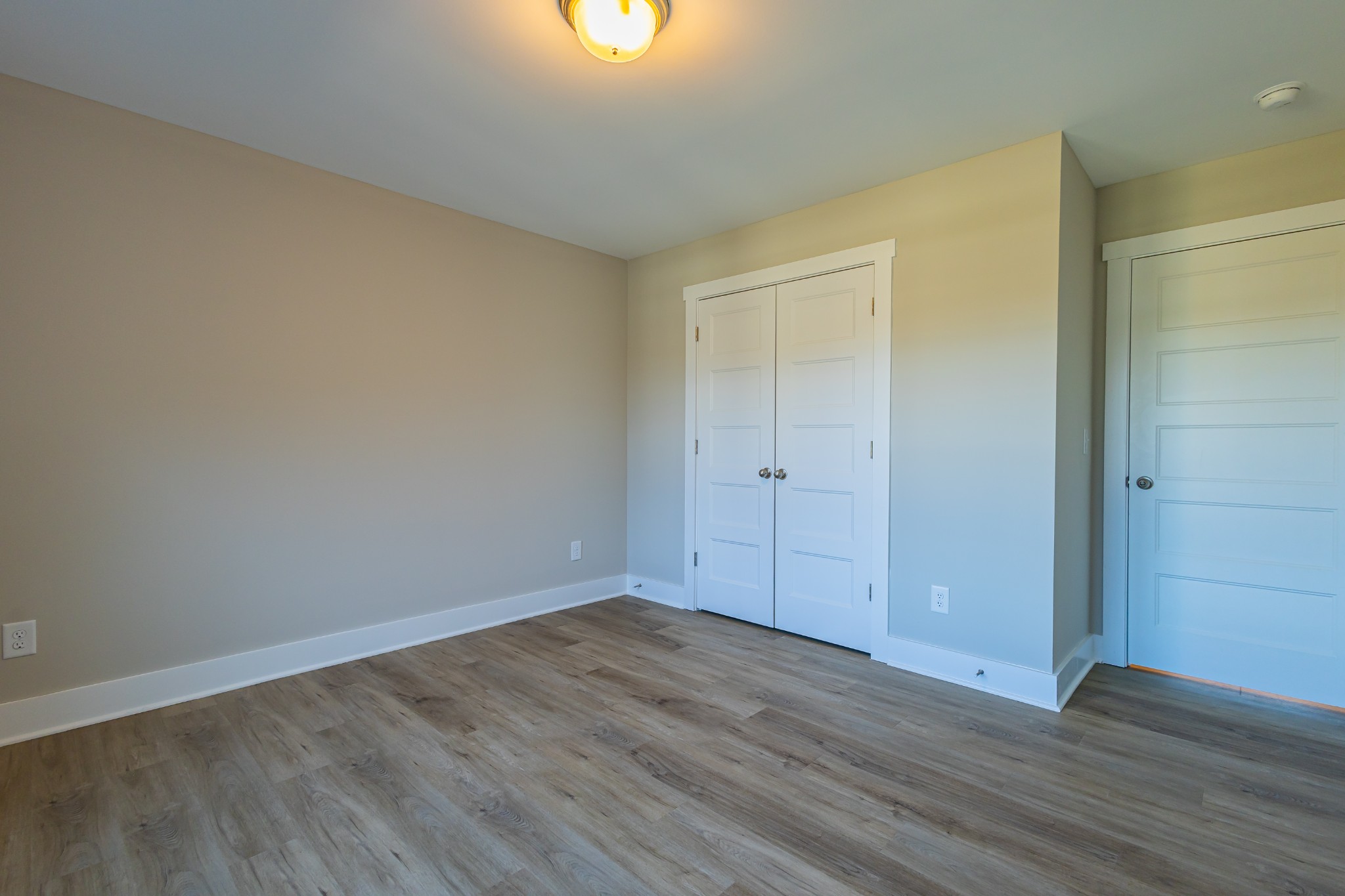 31 Brooklyn Avenue Manchester, TN 37355 - Photo 56 of 66 a view of an empty room with wooden floor and a window