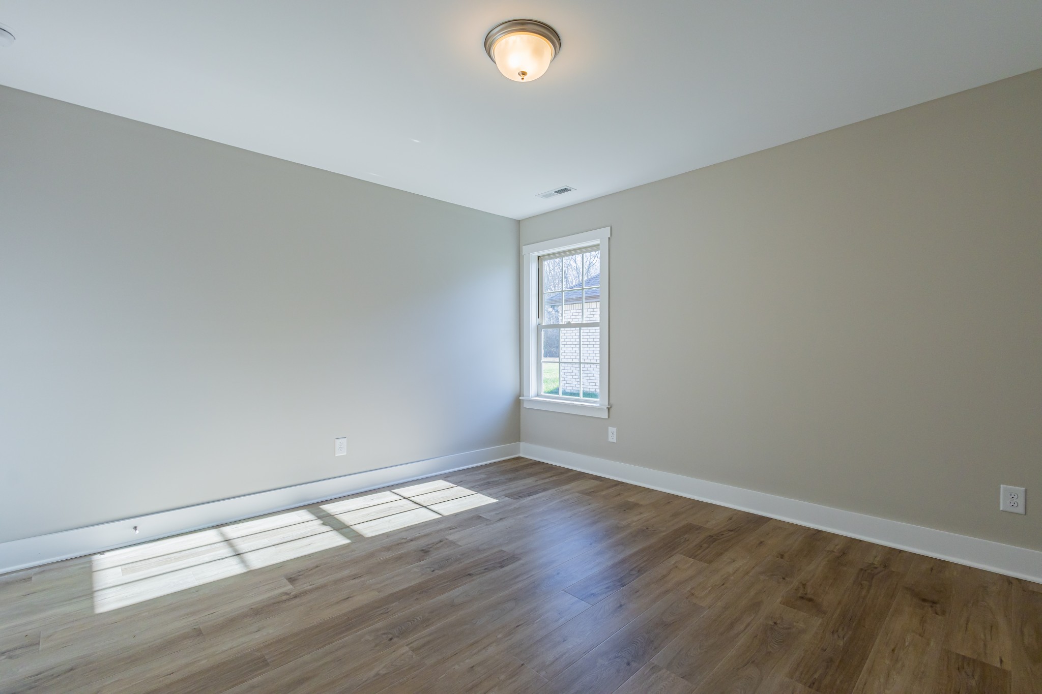 31 Brooklyn Avenue Manchester, TN 37355 - Photo 59 of 66 an empty room with wooden floor and windows