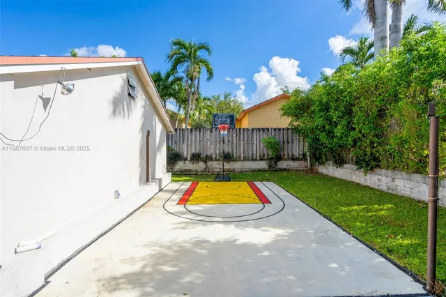 a view of swimming pool with a yard