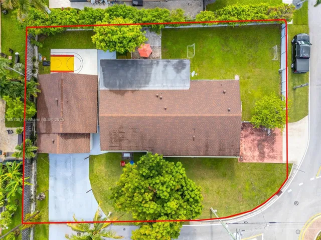 an aerial view of a house with a swimming pool