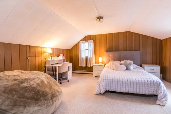 a bedroom with a bed and a cabinets