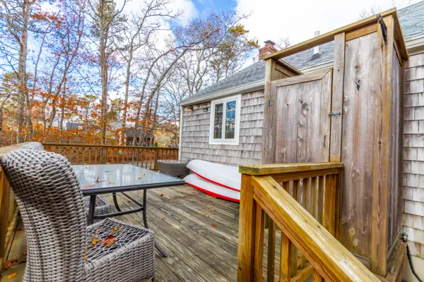 a view of balcony with wooden floor and outdoor seating