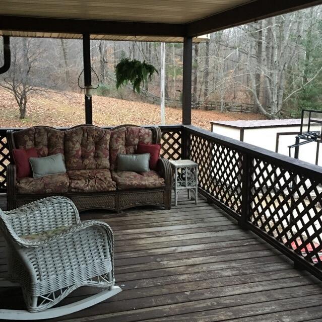 253 Lockwood Hollow Road Dover, TN 37058 - Photo 20 of 21 Beautiful covered deck overlooking fields and mini lake.