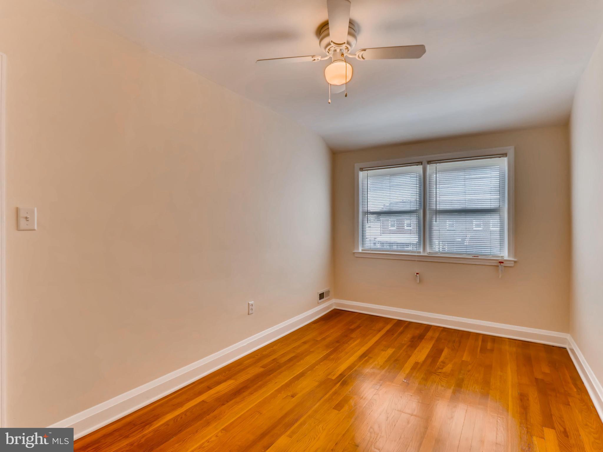 7915 Kavanagh Road Baltimore, MD 21222 - Photo 6 of 12 an empty room with a window
