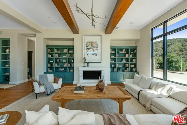 a bedroom with a large bed rug and a window