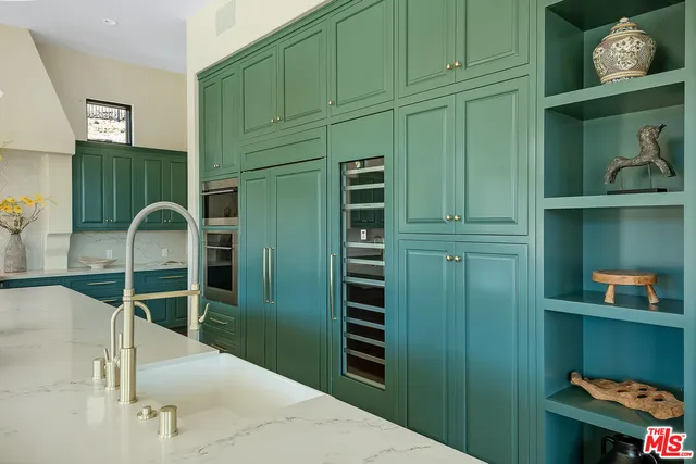 a living room with a bed furniture and a window